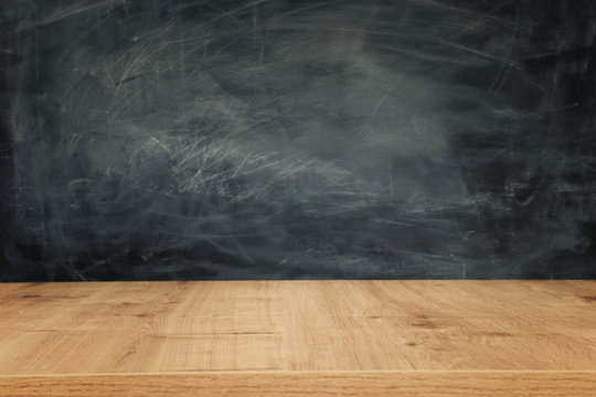 Education image – empty table and blackboard