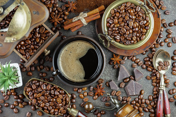 Black coffee beans roast in a pan in the smoke