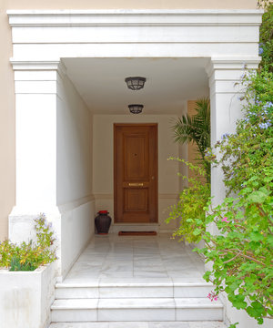 elegant contemporary house entrance with solid wooden door, Athens Greece © Dimitrios