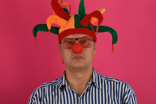 Close-up Portrait Of A Man With A Red Nose