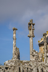 Fototapeta na wymiar The Calvary at Tronoen. The old calvary in granite stands near the chapel Notre-Dame in Saint-Jean-Trolimon, Finestere, Brittany