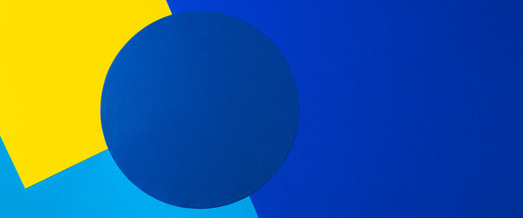 Abstract colored paper texture background. Minimal geometric shapes and lines in yellow, light blue and navy colours