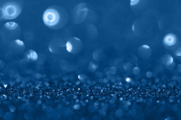 Blue festive background with sparkles in the bokeh. The concept of the celebration, the day of St. Valentine, New Year, birthdays, ceremonies, events, etc.