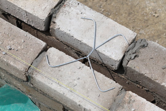 Wall ties, sometimes called ‘brick ties’, are used in buildings with cavity walls. They are used to join the two leaves of a cavity wall together, allowing the two parts to act as a one strong unit.