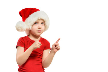 Blond boy in Santa hat points his fingers. Isolate
