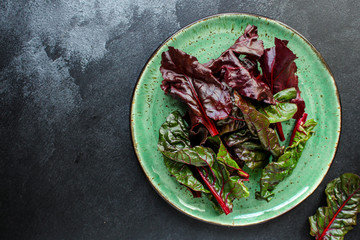 salad chard (appetizer serving plate, red chard) menu concept. food background. top view. copy space