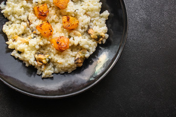 risotto mussels, vegetables (main course, rice seafood) menu concept. food background. top view. copy space