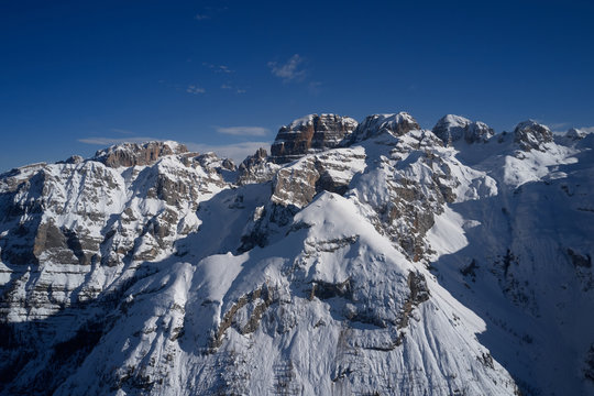 Panoramic aerial view of  Brenta Dolomites, Cima Tosa, Italy, snow on the slopes of the Alps  Madonna di Campiglio, Pinzolo, Italy. The most popular ski resorts in Italy. Aerial photography with drone