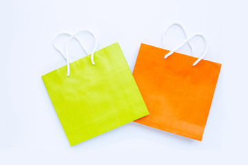 Paper shopping bags on white background.