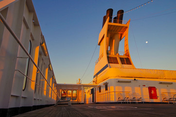Dream vacation holiday cruise on cruise ship liner with beautiful sunrise or sunset over the ocean...