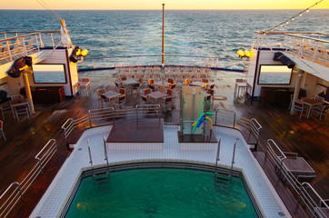 Dream vacation holiday cruise on cruise ship liner with beautiful sunrise or sunset over the ocean...