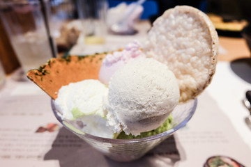 A cup of homemade icecream with rice biscuit