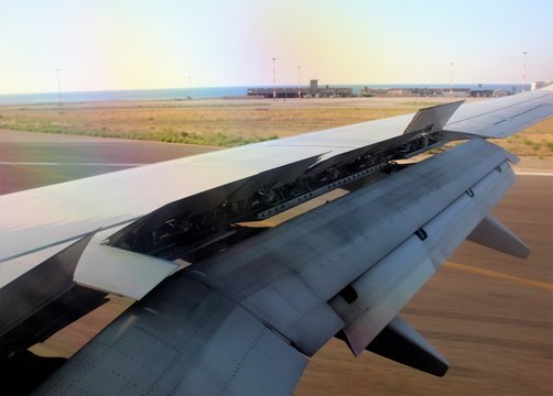 interesting image of the wing of a 737 aircraft during the landing phase with the flaps open