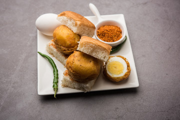 Egg Vada Pav or Anda  Wada Paav / Pao is a non-Vegetarian Fast Food Dish From Maharashtra, India