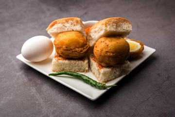 Egg Vada Pav or Anda  Wada Paav / Pao is a non-Vegetarian Fast Food Dish From Maharashtra, India