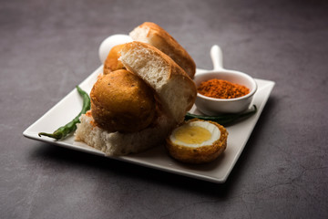 Egg Vada Pav or Anda  Wada Paav / Pao is a non-Vegetarian Fast Food Dish From Maharashtra, India