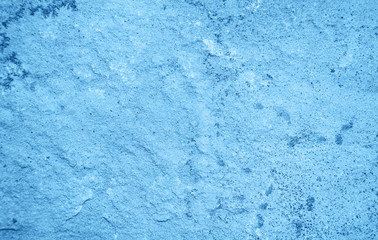 Fototapeta na wymiar Ancient stone wall toned classic blue color