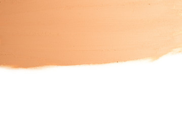 Liquid foundation texture. Make up for women. Top view. Isolated on white. Space for text or design.