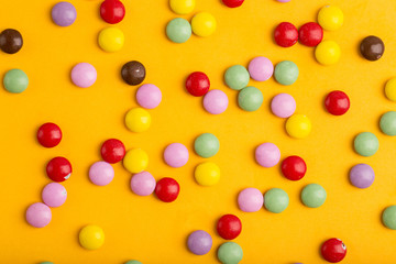 candy little multicolored on a yellow background