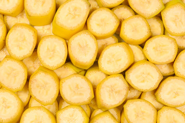 Fresh banana slices background. Top view.