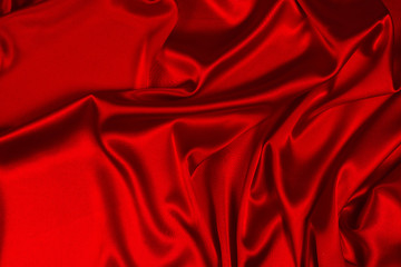 Fototapeta premium Red silk or satin luxury fabric texture can use as abstract background. Top view.