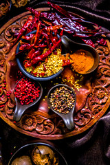 Top view Thai spices and herbs ingredient decoration on wood table for cook in home kitchen. 
