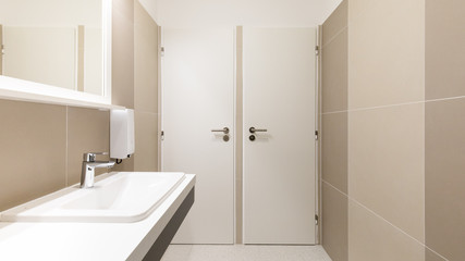 Fototapeta na wymiar white and brown toilet with washbasin