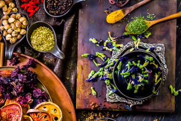 Top view Thai spices and herbs ingredient decoration on wood table for cook in home kitchen. 