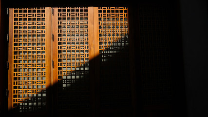 details of the doors in in chinese modern style with the incident light through. 