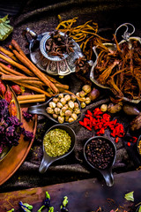 Top view Thai spices and herbs ingredient decoration on wood table for cook in home kitchen. 