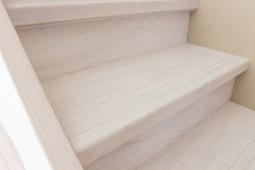 Obraz na płótnie Canvas stairs of a gray wooden staircase