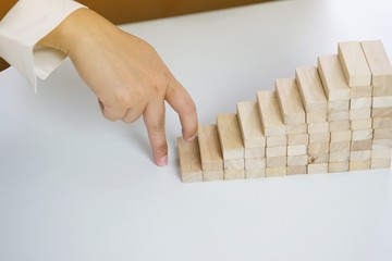.Planning risk and strategy in businessman gambling placing wooden block.Business concept for...