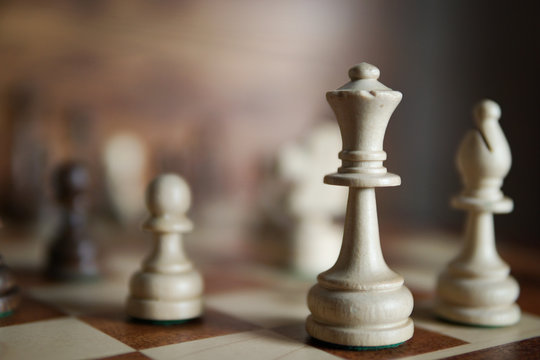 White chess on a chessboard.