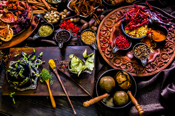 Top view Thai spices and herbs ingredient decoration on wood table for cook in home kitchen. 