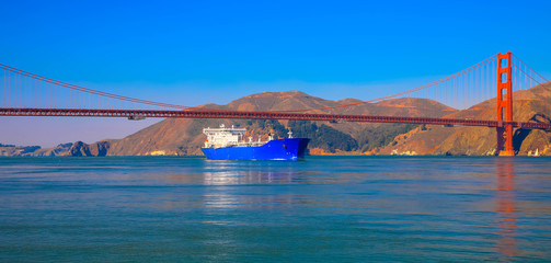 Container ship entering San Francisco Bay under Golden Gate Bridge