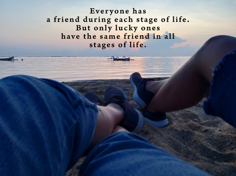 Inspirational quote - Everyone has a friend during each stage of life. But only lucky ones have same friends in all stages of life. With blurry image background of two legs on beach sands view.