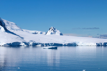 Fototapeta na wymiar The frozen coasts of an island along the coasts of the Antarctic Peninsula, Antarctica
