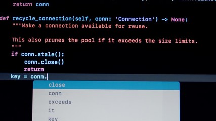 Developer type Python py programming code on laptop screen
