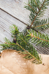 christmas tree branches on wooden background