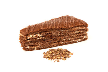 Slice of chocolate cake with milk filling and chocolate isolated on white background.