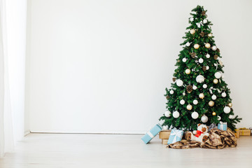 Christmas tree with gifts in the new year decor winter interior