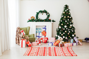 Christmas tree with gifts in the new year decor winter interior