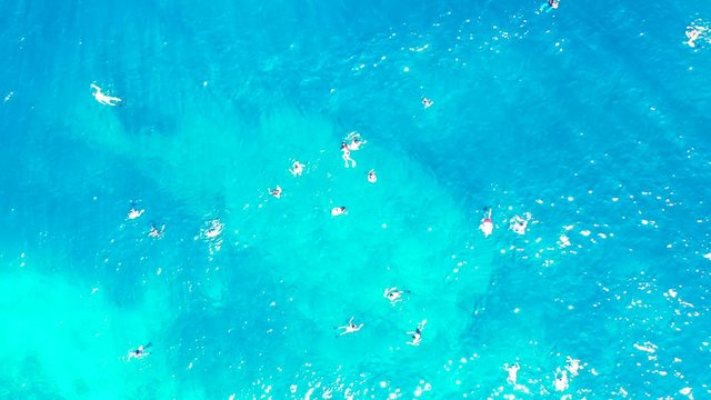 Samar Island, Philippines - Tourist Enjoy Swimming On The Clear Blue Ocean During Summer Vacation - Beautiful Tourist Destination - Aerial Shot
