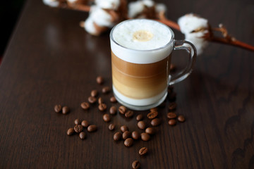 cereal coffee cappuccino in a glass and cotton on a dark background