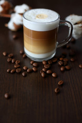 cereal coffee cappuccino in a glass and cotton on a dark background