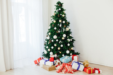 Christmas tree with gifts holiday new year interior decor as background