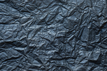 Flat lay, Close-up texture of Crumpled black paper background abstract. Detail texture of pattern with free space copy for text.