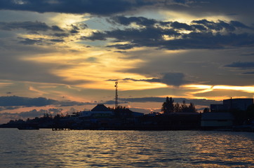 Naklejka premium building silhouette with background of sunset sky with a beautiful color of sky.