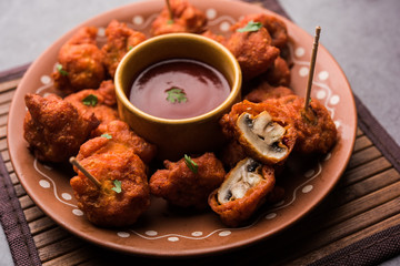 Mushroom 65, starter or appetiser food recipe from India. served in a plate with ketchup. selective focus