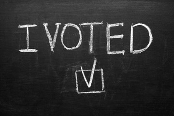 Text I VOTED on dark background